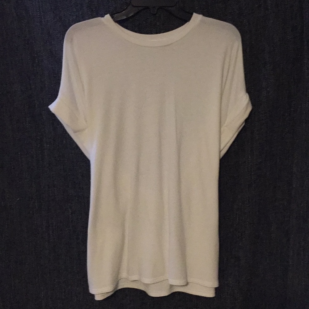 Cherish off-white top. Tie-accent.